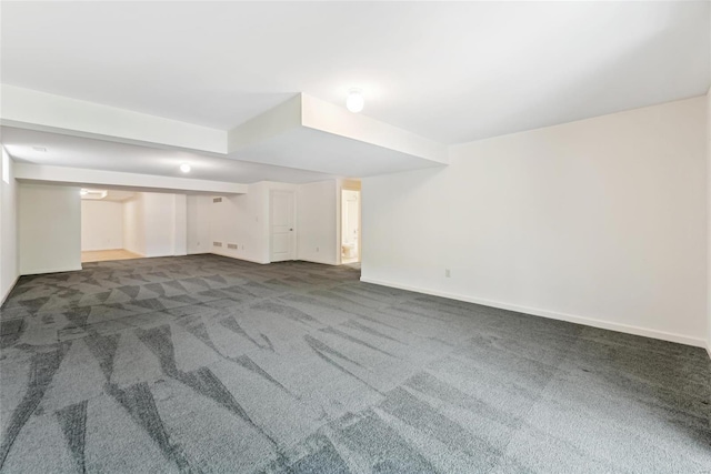 basement with dark carpet