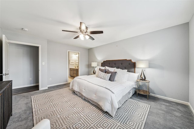 carpeted bedroom featuring ceiling fan and ensuite bathroom