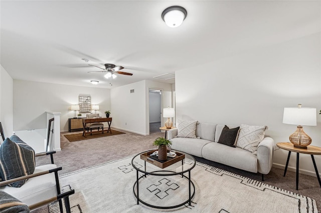 living room featuring light colored carpet and ceiling fan