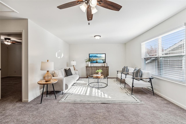 carpeted living room featuring ceiling fan