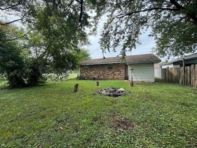 view of yard with an outdoor fire pit