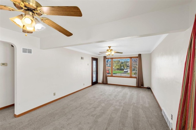 empty room featuring light carpet and ceiling fan