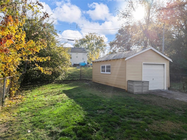 garage featuring a lawn