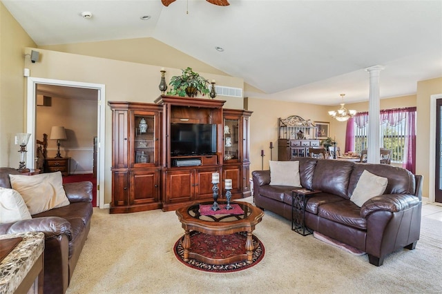 living room with ceiling fan with notable chandelier, lofted ceiling, ornate columns, and light colored carpet