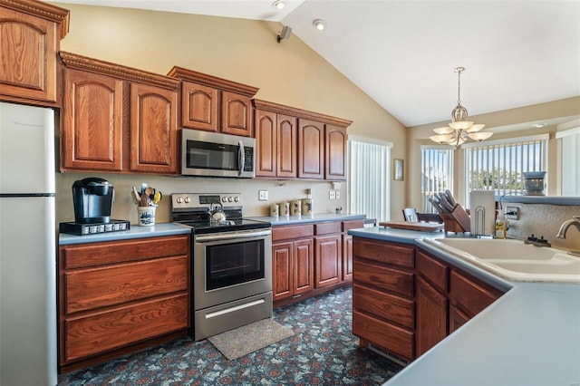 kitchen with vaulted ceiling, sink, stainless steel appliances, and a chandelier