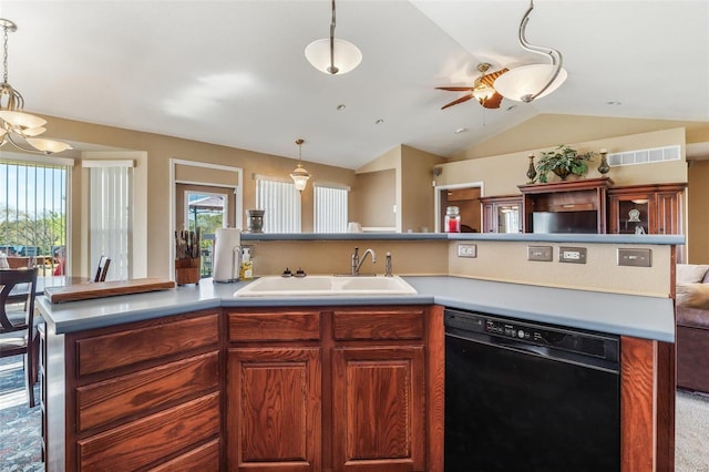 kitchen featuring black dishwasher, lofted ceiling, hanging light fixtures, and sink