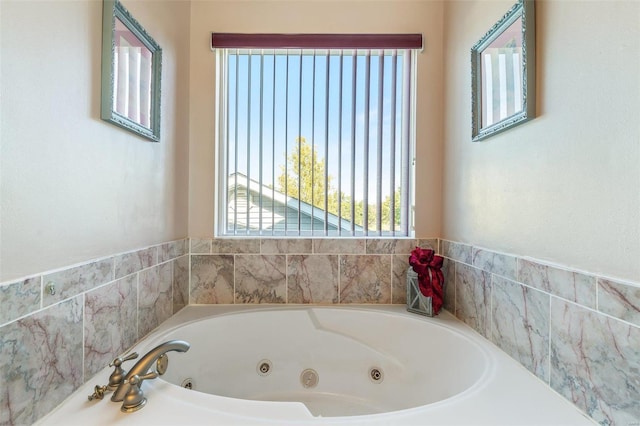 bathroom with a tub to relax in