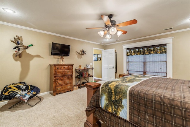 bedroom featuring ornamental molding, ceiling fan, and carpet floors