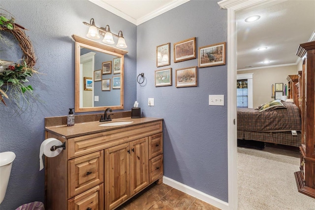 bathroom featuring crown molding, toilet, tile patterned flooring, and vanity