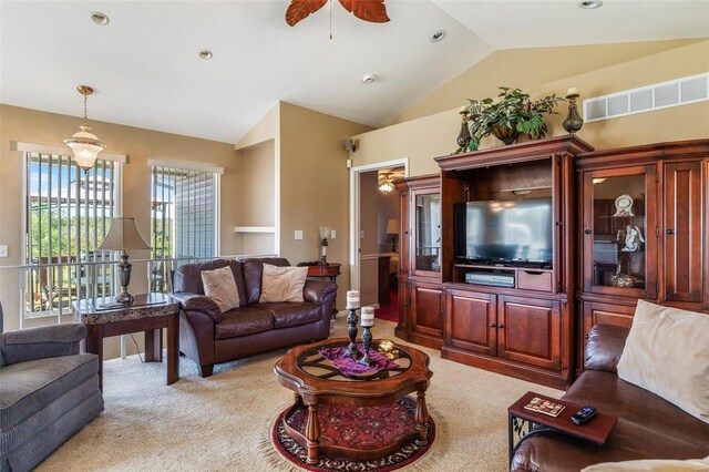 carpeted living room featuring lofted ceiling and ceiling fan