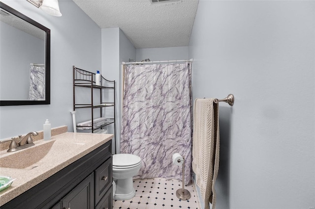 bathroom featuring vanity, a shower with shower curtain, a textured ceiling, and toilet