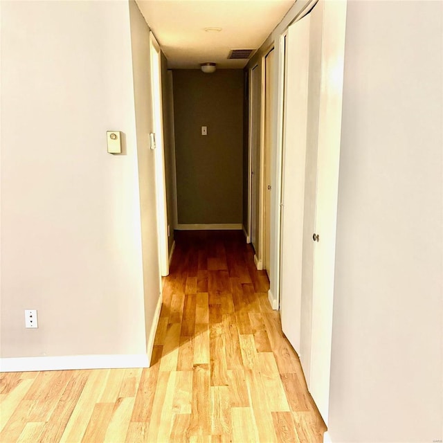 hallway featuring light wood-type flooring