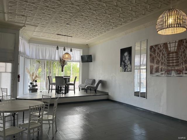 dining room featuring crown molding