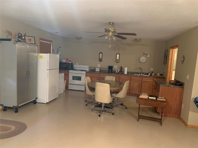 interior space featuring sink and ceiling fan