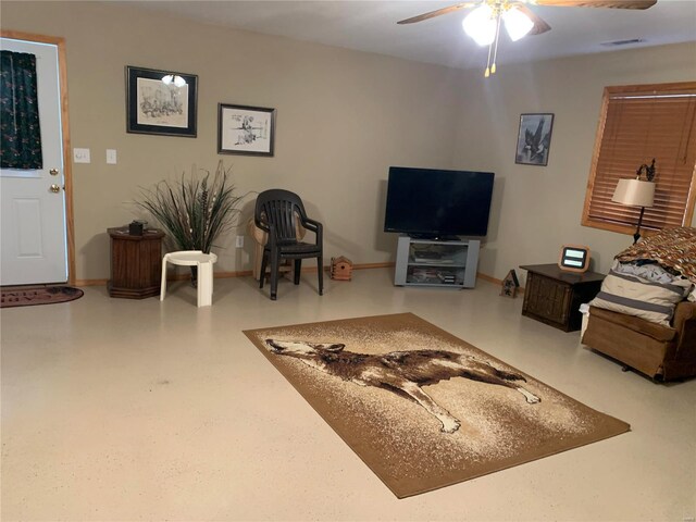 living room featuring ceiling fan