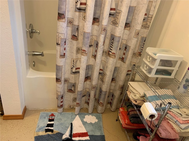 bathroom featuring shower / bath combination with curtain