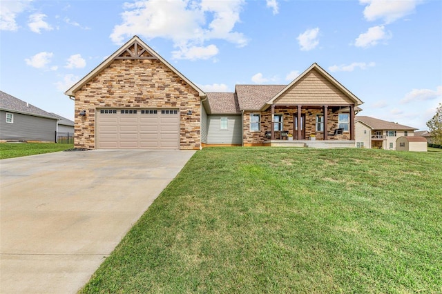 view of front of home featuring a garage, a porch, and a front lawn