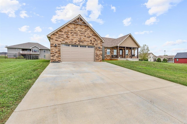 view of front of property featuring a front lawn and a garage