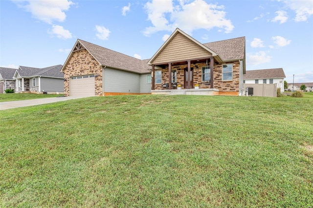 view of front of house with a front yard, a porch, and a garage