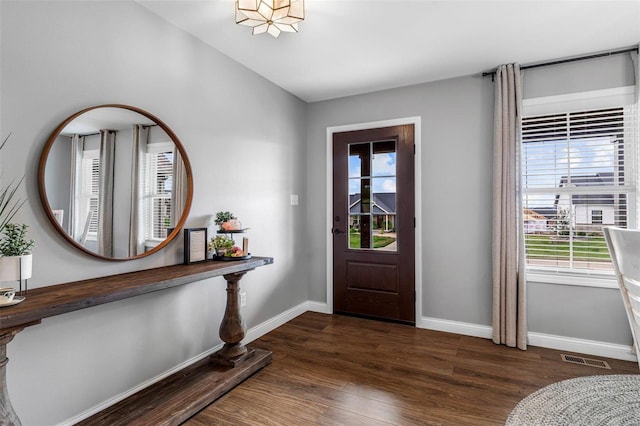 foyer with dark hardwood / wood-style floors