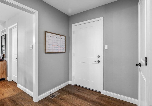 entrance foyer with dark hardwood / wood-style floors