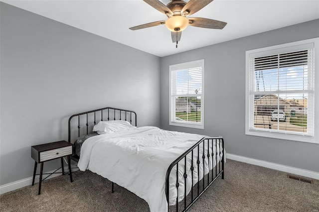 bedroom with ceiling fan and carpet flooring