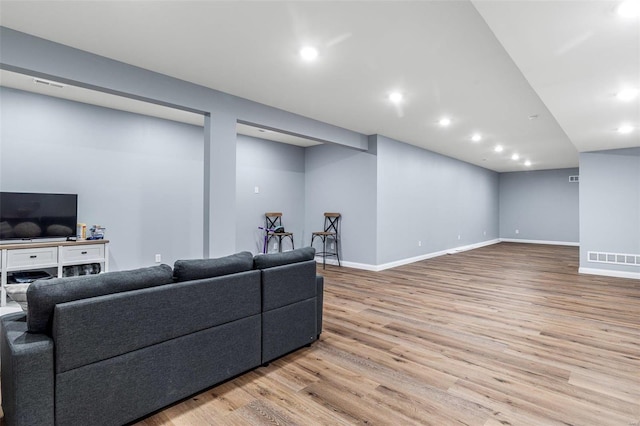 living room with light hardwood / wood-style floors