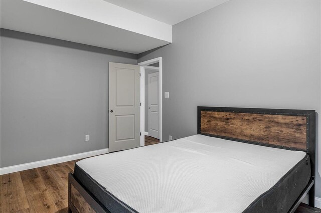 bedroom featuring dark hardwood / wood-style floors