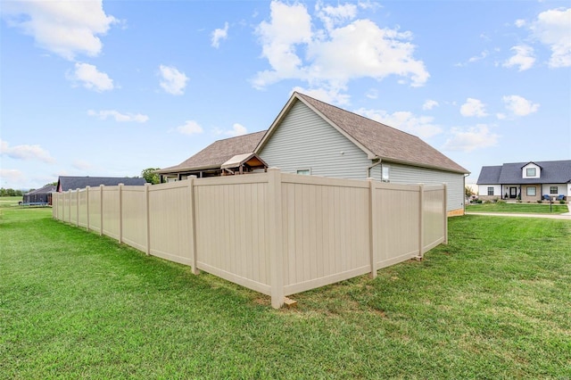 view of property exterior featuring a lawn