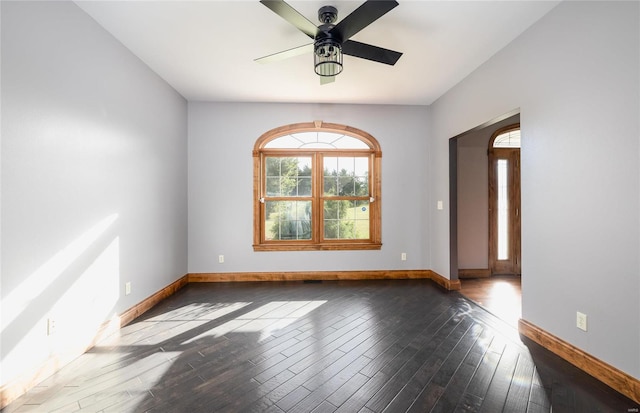 spare room featuring ceiling fan and hardwood / wood-style flooring