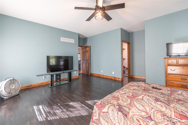 bedroom with ceiling fan and dark hardwood / wood-style flooring