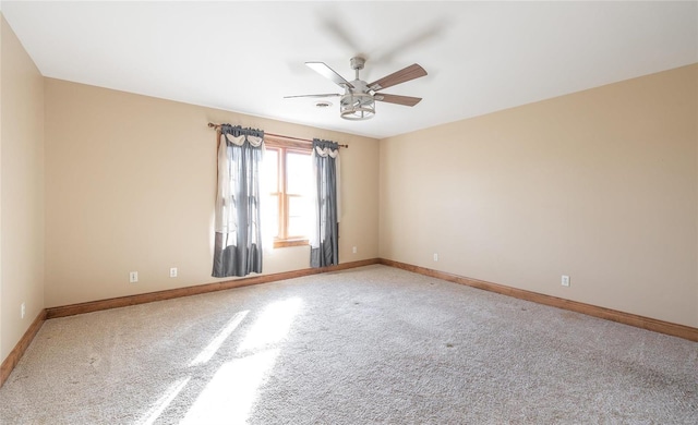 unfurnished room featuring carpet and ceiling fan