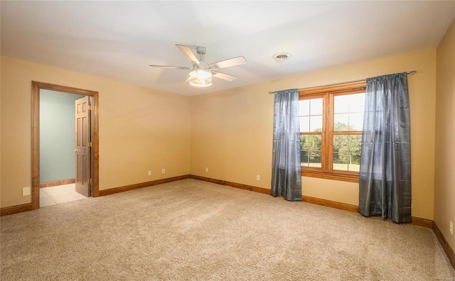 carpeted empty room with ceiling fan