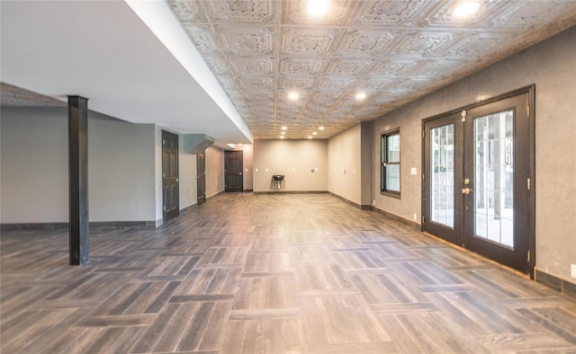 interior space with french doors and dark parquet flooring