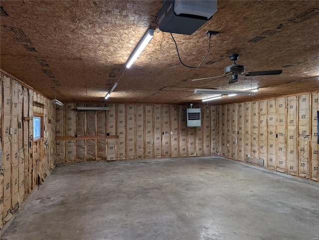 garage with a garage door opener and ceiling fan