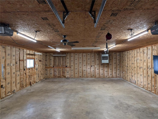 garage with ceiling fan and a garage door opener