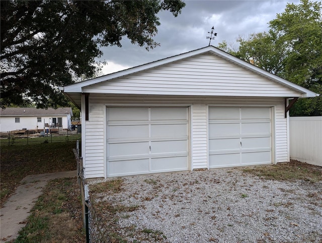 garage featuring wooden walls