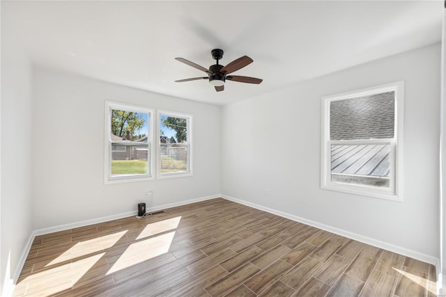 spare room with light hardwood / wood-style flooring and ceiling fan