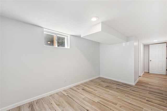 basement featuring light hardwood / wood-style floors