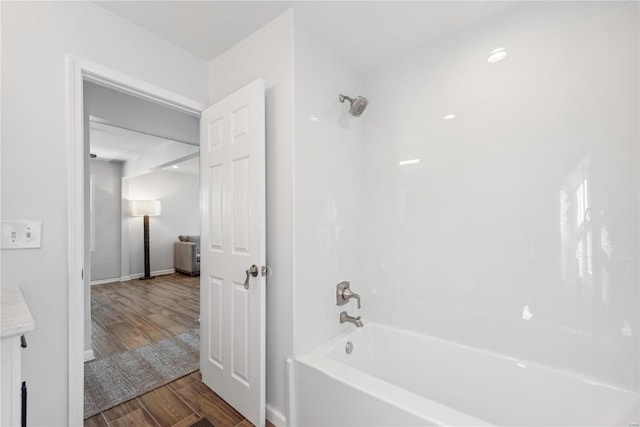 bathroom featuring vanity,  shower combination, and hardwood / wood-style flooring