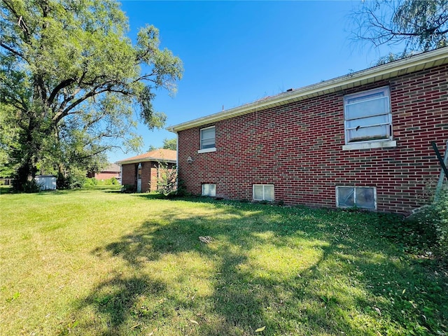 view of property exterior with a yard