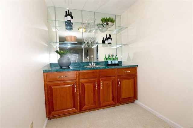 bar featuring sink and light carpet