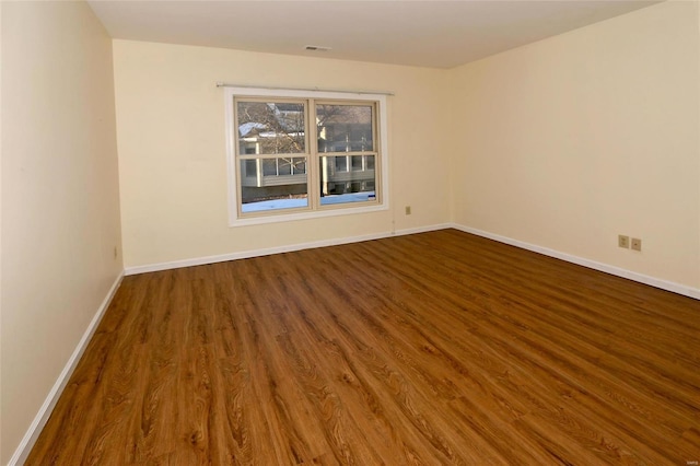 unfurnished room featuring hardwood / wood-style flooring