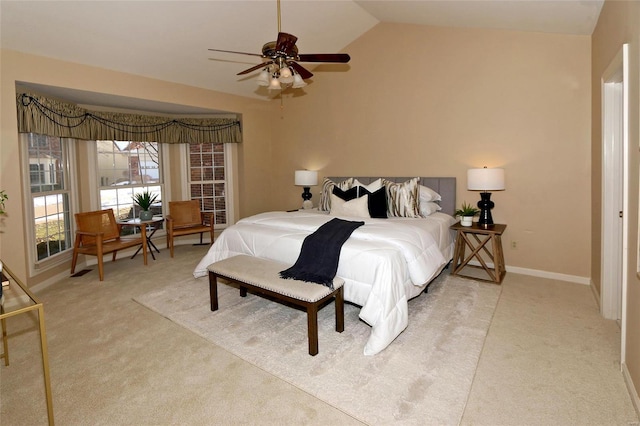 bedroom with light carpet, vaulted ceiling, and ceiling fan