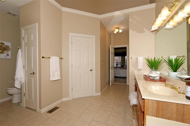 bathroom featuring crown molding, tile patterned floors, toilet, and vanity