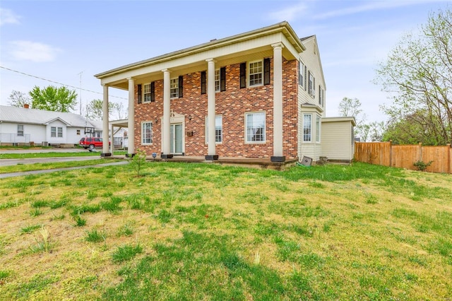 greek revival house with central air condition unit and a front yard