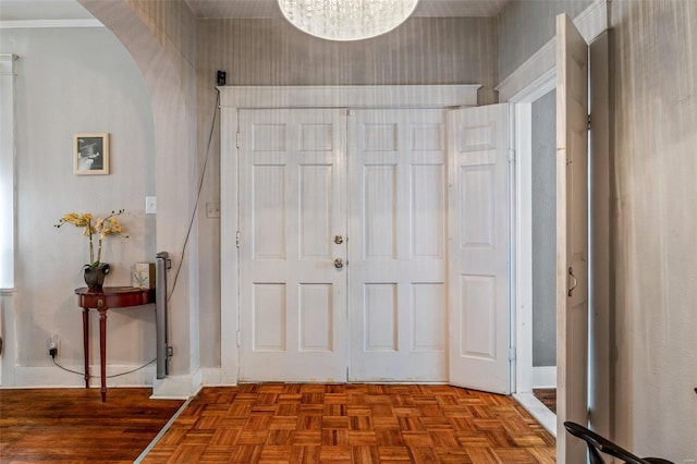 foyer entrance with light parquet flooring