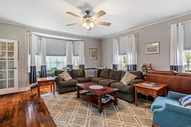 living room with wood-type flooring, ceiling fan, plenty of natural light, and crown molding