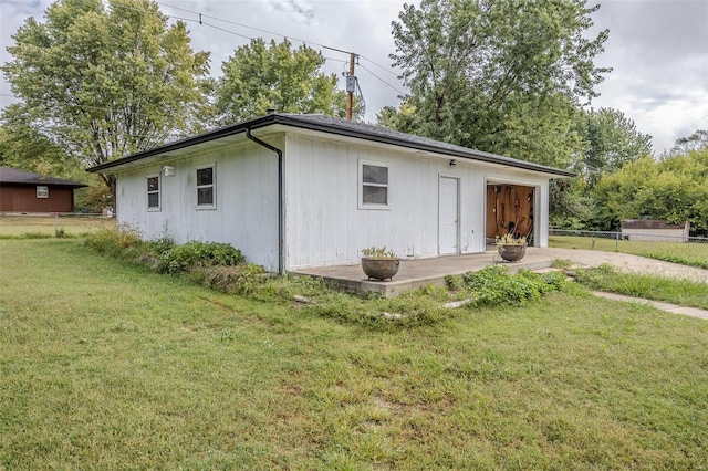 view of home's exterior featuring a patio area and a yard