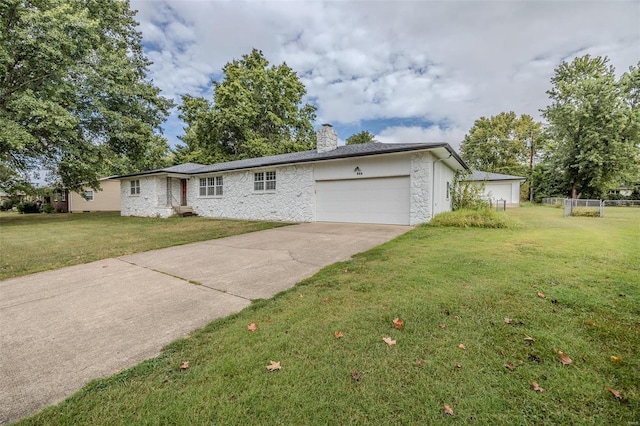 single story home featuring a front yard and a garage